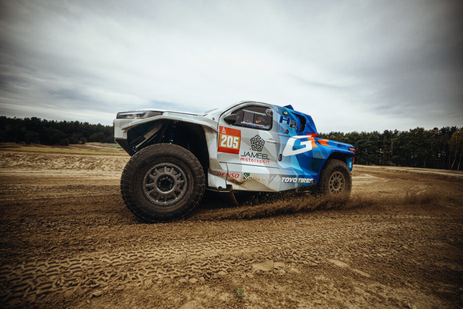 Toyota DKR GR FC Hilux hydrogen fuel cell truck testing on sand, side view