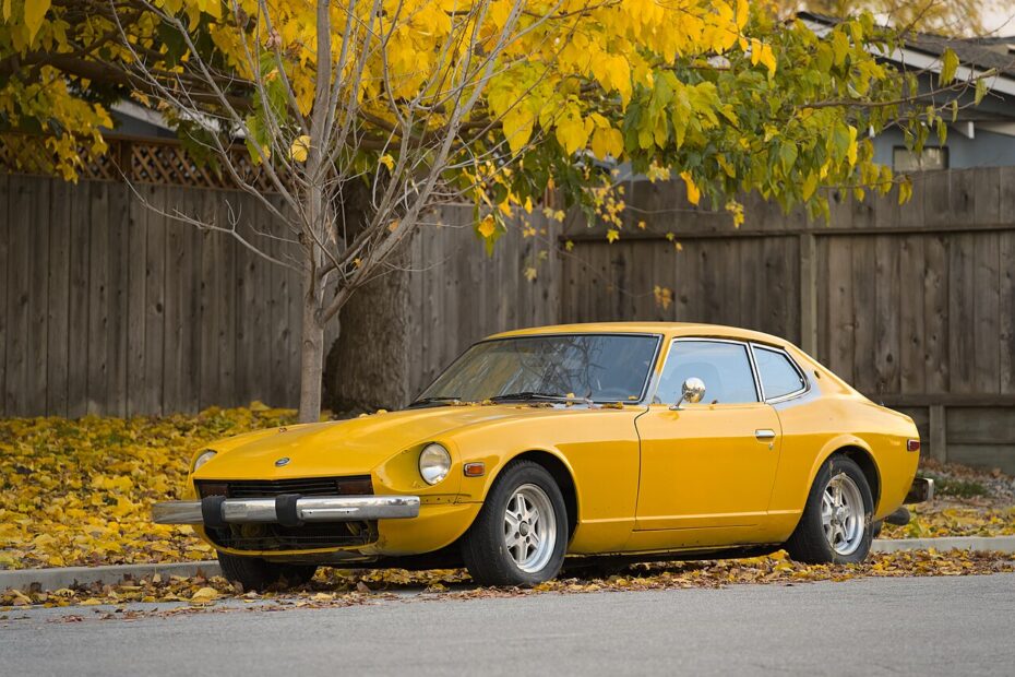 Yellow Datsun 240Z, the S30 Z, parked on a street